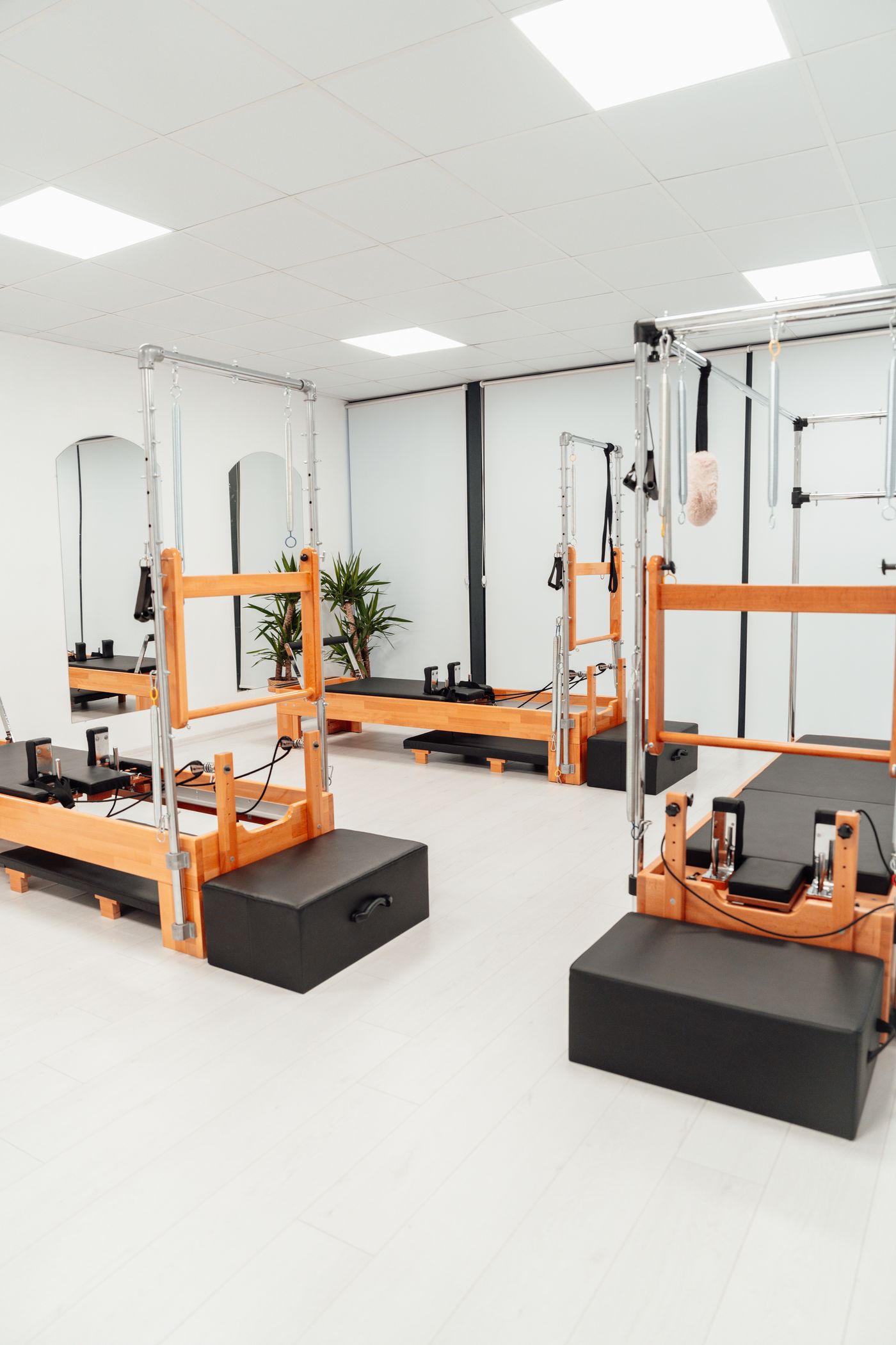 Bright Pilates studio with reformer machines